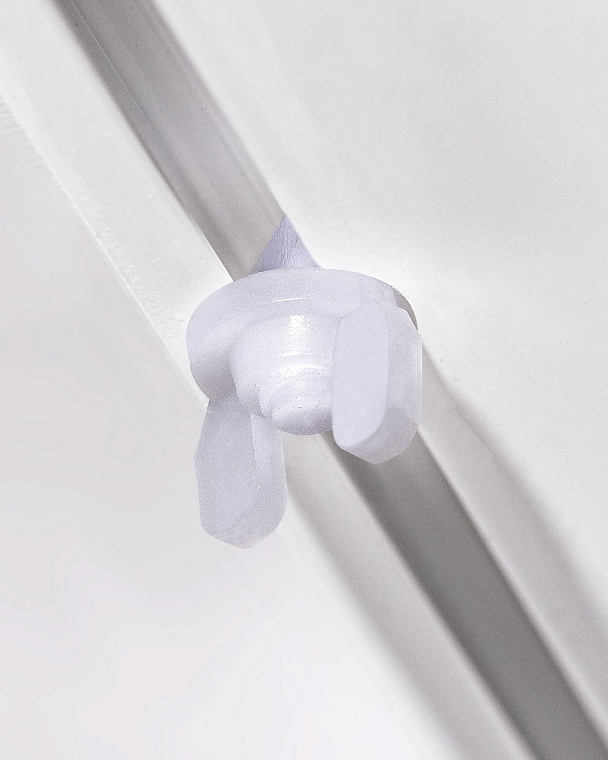 Butée d'arrêt à rail de plafond